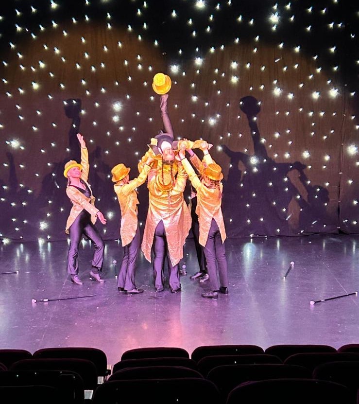 Group of children performing lively modern dance routine in Bradford